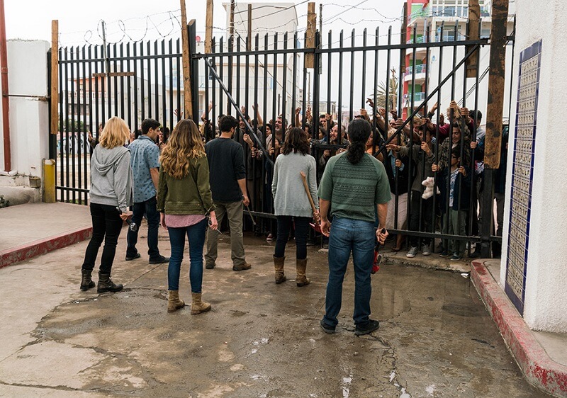 Survivors at the gates of the hotel pleading to get in