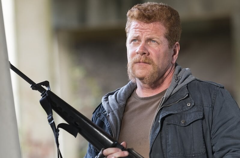 Abraham standing tall with rifle