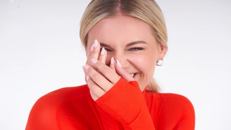 Photo of Kelsea Ballerini in a red top