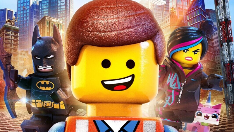 Emmet smiles on the cover of The Lego Movie, surrounded by his friends.