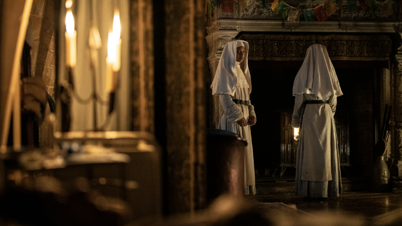 Two nuns stand in a convent room, one staring towards the camera in The Walking Dead: Daryl Dixon.