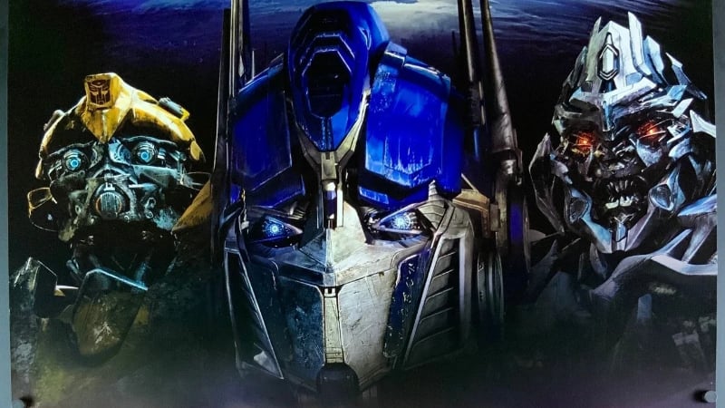 Bumblebee, Optimus, and Megatron on the Transformers (2007) film poster.