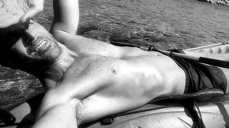 Photo of Bradley Cooper shirtless on a Kayak