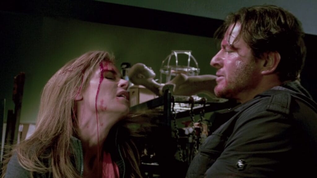 Jill Tuck and Mark Hoffman in Saw