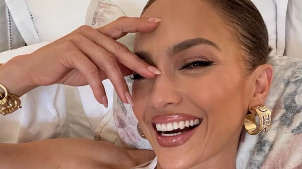 Jennifer Lopez Proudly Shows Off Her ‘Coconuts’ in Heartwarming Post Jennifer Lopez posing in a tank top for bed selfie