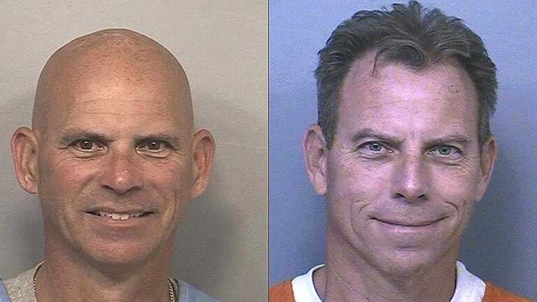 Erik and Lyle Menendez grin widely on their mugshots from jail in California.