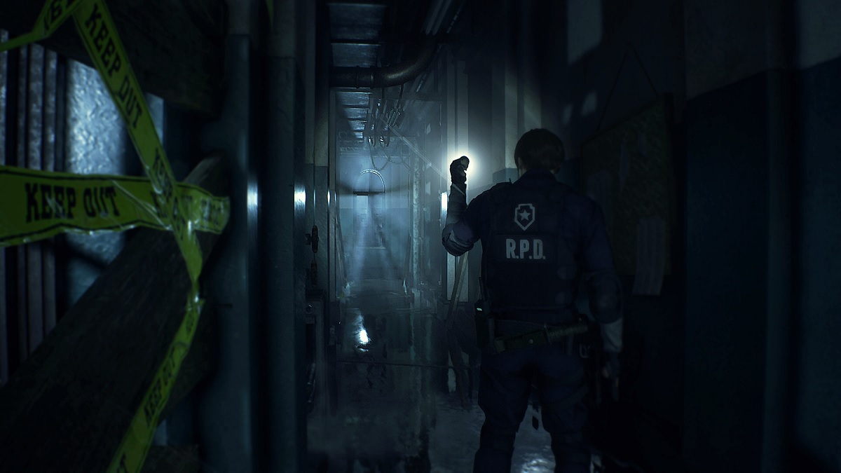 leon looking down a dark hallway in resident evil 2 remake