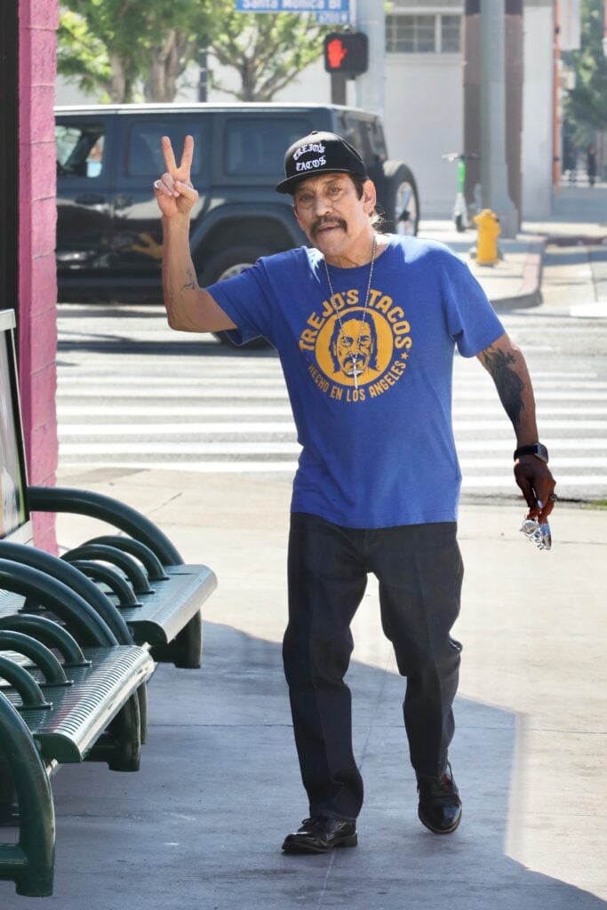 *EXCLUSIVE* Danny Trejo packs donuts from his Highland shop and snaps photos with fans on his way out