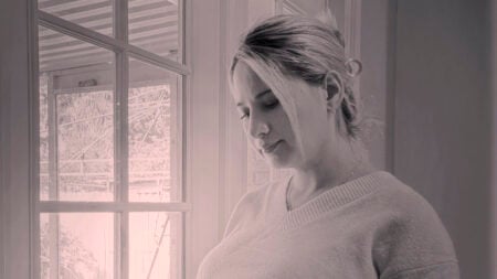 Pregnant Gypsy-Rose Blanchard posing next to a window