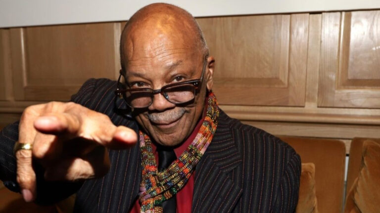 Jazz Legend Quincy Jones Dead at 91 A close-up of Quincy Jones reaching toward the camera