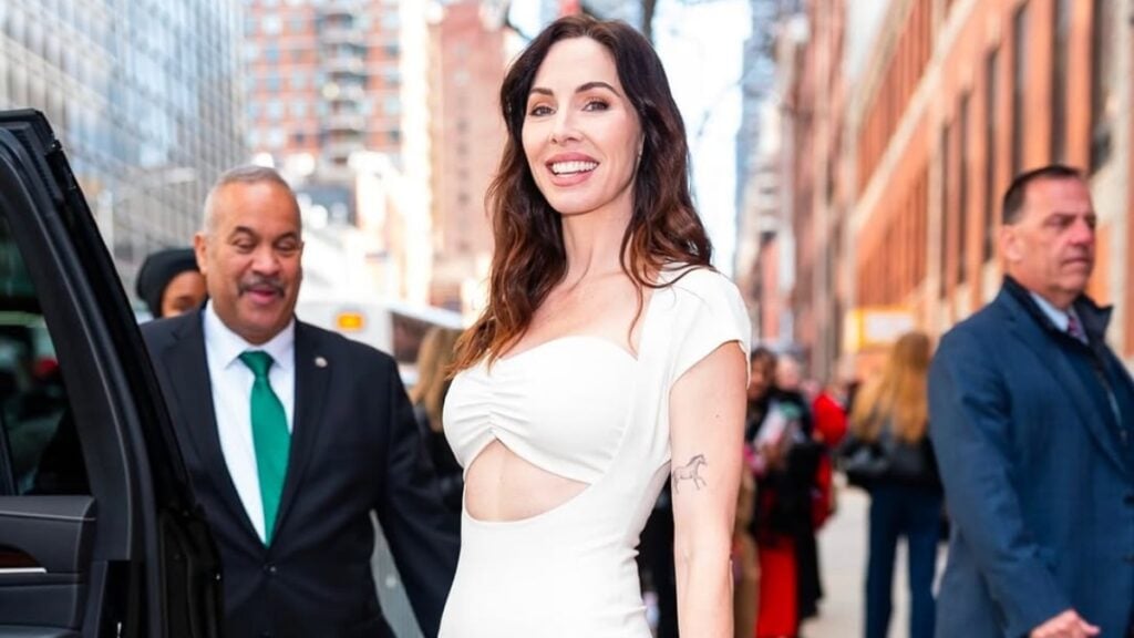 Whitney Cummings in a white dress.