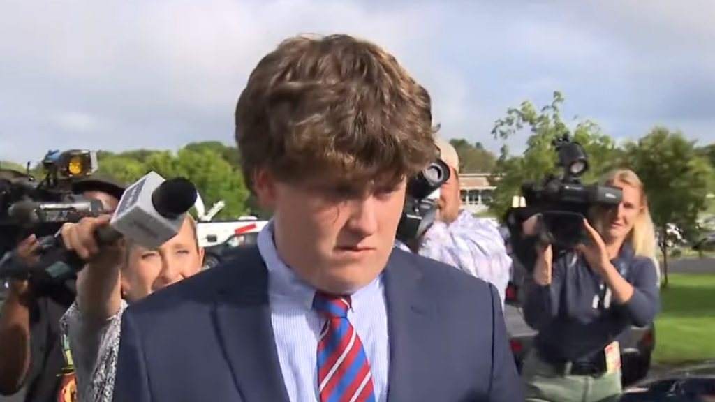 John P. Sheeran Walking with Reporters