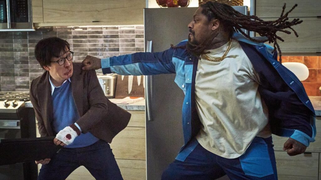 Ke Huy Quan and Marshawn Lynch in Love Hurts