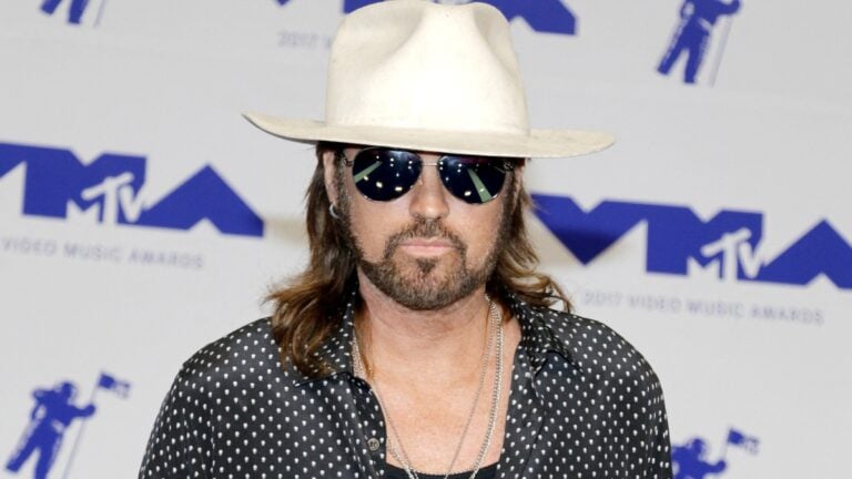 Billy Ray Cyrus wearing sunglasses at event