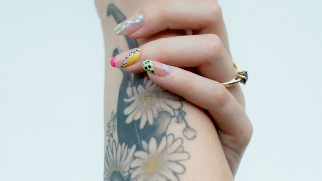 Person's Hand Holding Their Arm Tattoo