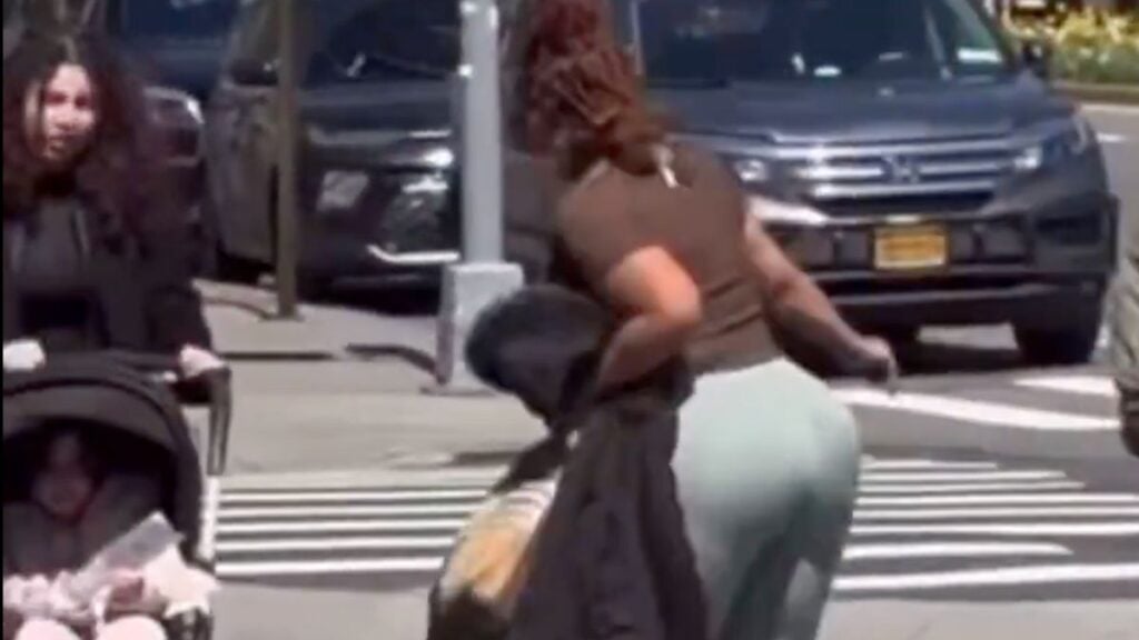 Woman spitting on another woman in NY
