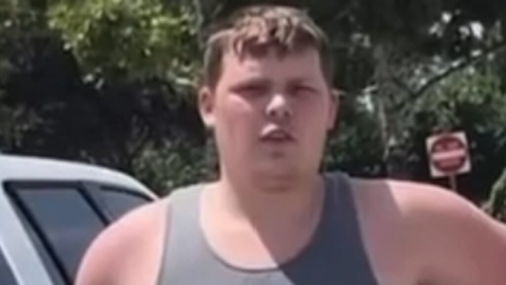 A man in a sleeveless shirt